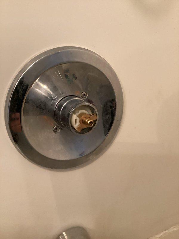 Responded to emergency water leak call where shower handle mechanism had failed, causing continuous water flow. Upon inspection, discovered broken plastic cartridge component within the valve stem assembly. Removed damaged parts, installed replacement cartridge, reassembled valve hardware, and verified proper water shutoff function with multiple test cycles.