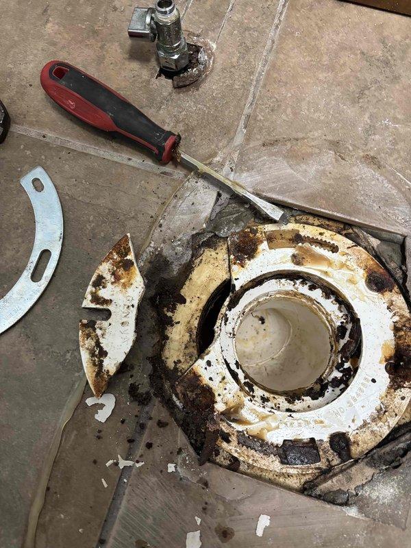 Completed installation of whole home water filter system in basement utility area, properly connecting to existing copper and PVC plumbing infrastructure. Replaced severely corroded toilet flange and installed new toilet as quoted, ensuring proper seal and function.