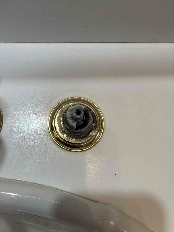 Completed quoted repair involving replacement of two faucets and installation of two new shut-off valves. Removed deteriorated drain assembly that showed significant mineral buildup and discoloration. Work included accessing and replacing the under-sink plumbing components, ensuring proper water supply connections with the newly installed hardware.