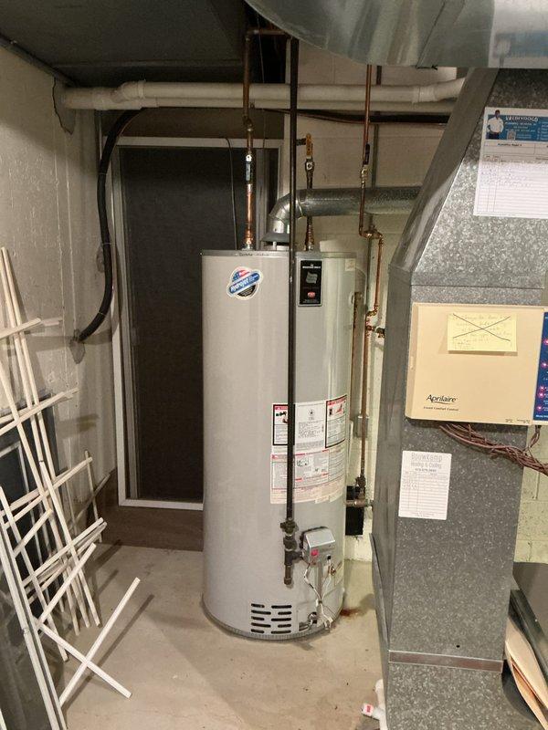 Successfully installed a water softener system in the utility room, integrating it with the existing plumbing infrastructure. The installation included connecting the blue cylindrical water softener tank and filtration tank to the home's water supply using appropriate copper and PVC piping. All connections were properly secured and tested to ensure optimal system performance with no leaks.