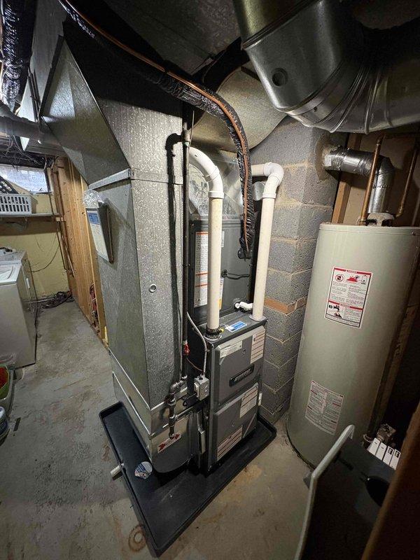 Completed installation of new furnace and AC system in basement mechanical room. Installed new PVC venting for high-efficiency system with proper connections to existing ductwork. System was tested and verified operational with all manufacturer specifications met.