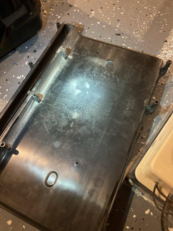 Responded to service call for a non-functional furnace, approximately 15 years old. Upon inspection, discovered significant wear on the heat exchanger panel and assessed the unit installed in the basement utility area. Determined furnace required replacement due to age and condition; advised customer accordingly.