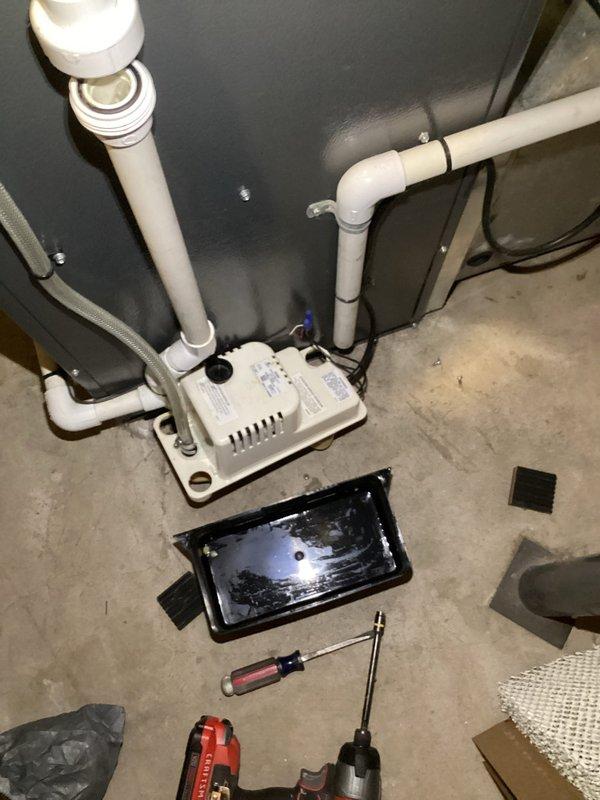 Completed annual heating maintenance service on a 12-year-old furnace with humidifier. Inspected condensate pump system and found water accumulation in the drain pan. Cleaned the pump, verified proper drainage, and confirmed all connections were secure. System is now operating efficiently with proper condensate removal.