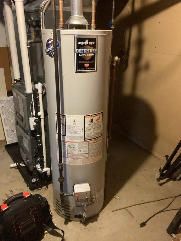 Completed annual heating tune-up on ENE model furnace with warranty through 2035. Inspected condensate drainage system and water heater, noting proper operation of the Defender Safety System. No humidifier present on system; photos taken to document current equipment condition.