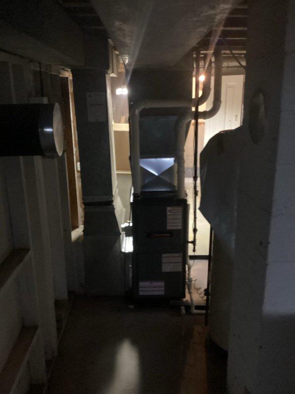 Successfully installed new furnace in basement utility room. Unit was properly connected to existing ductwork with new PVC venting system. System was mounted on protective pad and all connections were verified for proper operation.