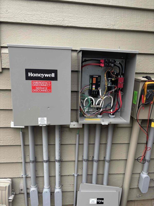 Performed scheduled annual tune-up service on Honeywell WT generator (serial #06-2027) under current maintenance agreement. Conducted comprehensive inspection of electrical service panel and Generac engine components, verifying proper connections and functionality. All systems operational with no issues detected; documentation completed with supporting photographic evidence.