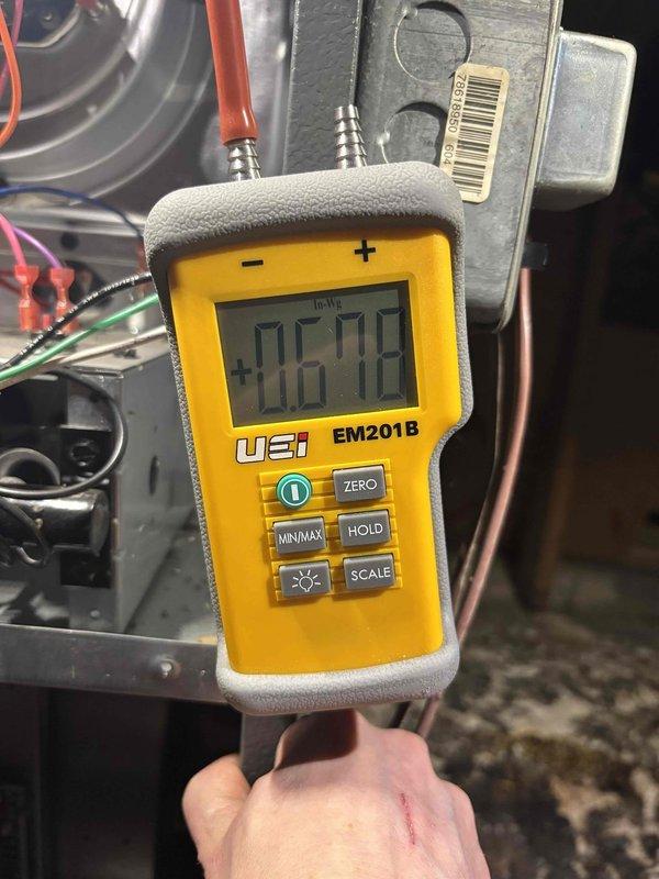 Diagnosed furnace issue preventing system from exceeding 60°F. Performed inspection of pressure switch and electrical components, taking voltage readings with EM201B meter. Determined proper function restored after servicing the recently installed (2023) equipment.