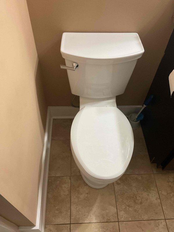 Successfully installed American Standard toilet in corner bathroom location. Properly secured fixture to existing beige ceramic tile flooring and connected to water supply. Final inspection confirmed proper operation with no leaks.