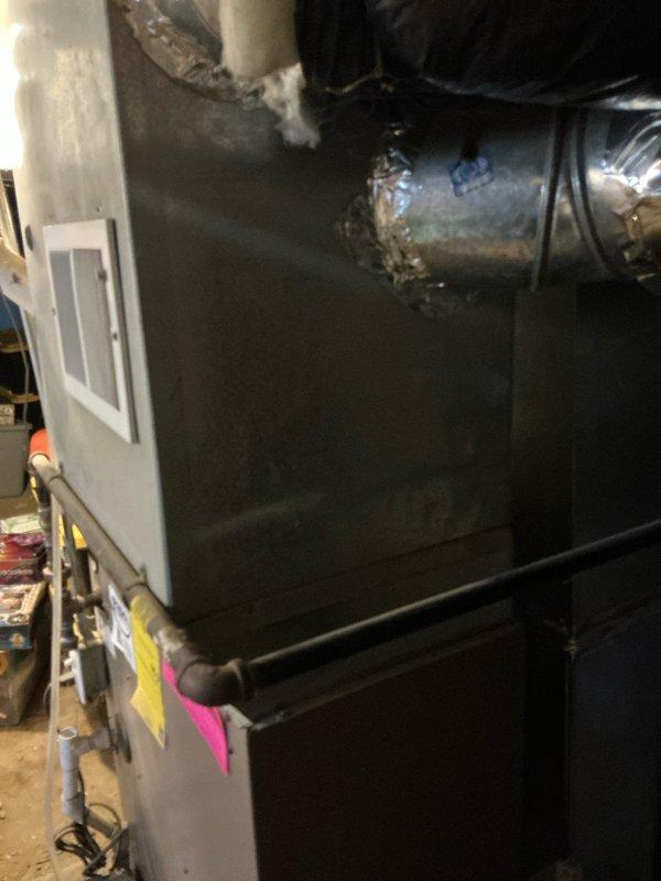 Completed estimate for dual AC unit replacement in a duplex property. Assessed existing HVAC systems with furnace located in basement for lower unit and in attic for upper unit. Documented current equipment condition with photos and evaluated space for potential mini-split installation as an alternative solution.