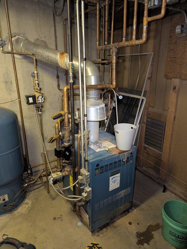 Responded to service call regarding boiler expansion tank installation. Inspected aging boiler system with extensive copper piping network showing significant oxidation and corrosion at connection points. Successfully installed new expansion tank, integrated it with the existing system, and verified proper system pressure and operation.