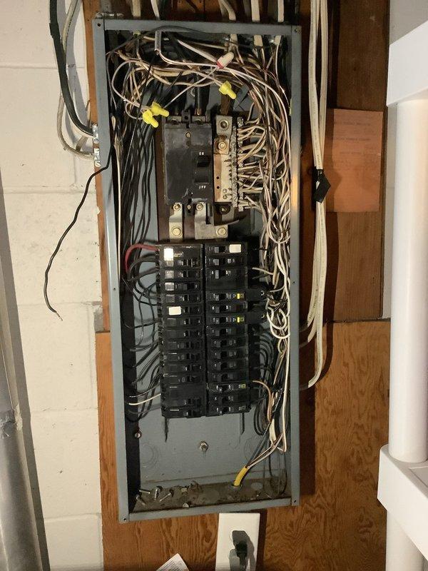 Performed diagnostic inspection on non-functioning HVAC system, accessing internal components including circuit board, motor, and wiring connections. Inspection of electrical panel revealed cluttered wiring with potential connection issues affecting furnace operation; restored proper electrical connections and verified system operation before closing access panels.