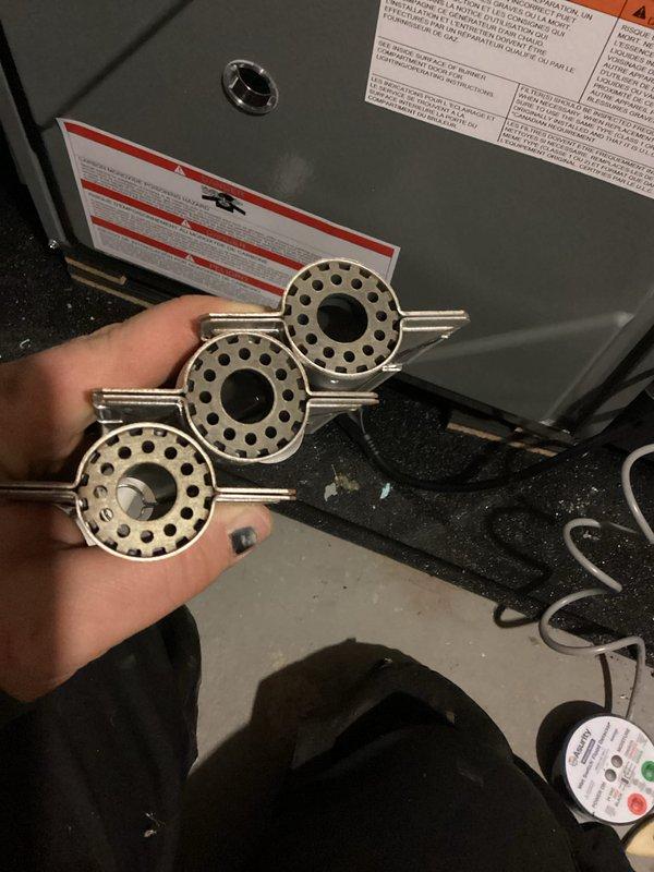 Performed annual maintenance on furnace and humidifier system. Removed and cleaned condensate collection tray that showed liquid accumulation. Replaced three circular metal components with perforated design that serve as essential mechanical parts within the system.