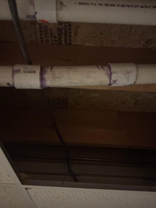 Completed exhaust repairs involving PVC piping in crawlspace/ceiling area. Installed new pipe sections with proper PVC primer/adhesive at connection points. Ensured proper routing of drainage system through structural joists with appropriate supports and connections.