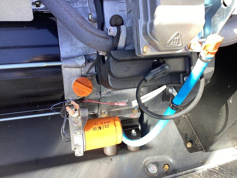 Performed scheduled 2-year tune-up on Honeywell WT 09-2033 generator. Inspected interior components including motor assembly, control module, and ventilation system. Replaced fuel filter (dated 03/19/22) and verified proper connection of all hoses and wiring, with special attention to the blue fuel line integrity.