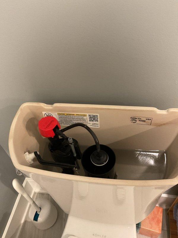 Responded to service call regarding shower and tub drainage issues in basement bathrooms. Upon inspection of the Kohler toilet fixtures, removed tank covers to examine internal mechanisms. Observed functioning flush valve assemblies, float systems, and flapper valves in good working condition with no visible leaks or damage. Addressed drainage problems in both fixtures by clearing obstructions and verifying proper water flow.