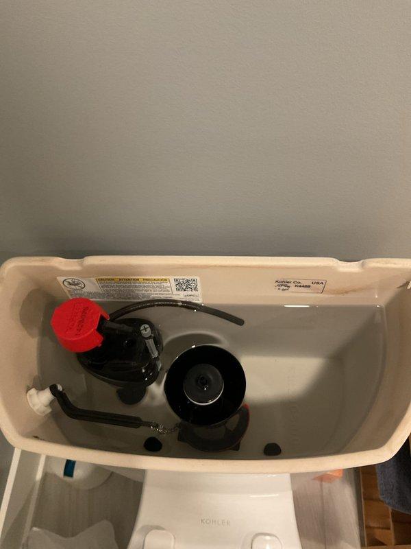 Responded to service call regarding shower and tub drainage issues in basement bathrooms. Upon inspection of the Kohler toilet fixtures, removed tank covers to examine internal mechanisms. Observed functioning flush valve assemblies, float systems, and flapper valves in good working condition with no visible leaks or damage. Addressed drainage problems in both fixtures by clearing obstructions and verifying proper water flow.