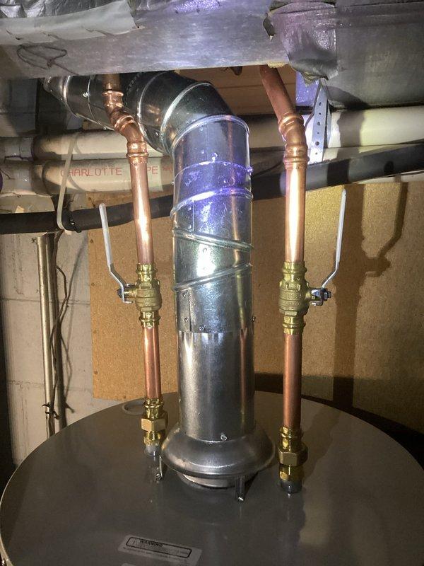 Successfully installed a Bradford White 40-gallon natural gas water heater with 6-year warranty. Connected new copper water lines with appropriate valves and installed metal exhaust flue piping according to code requirements. Unit was properly positioned, secured, and tested for safe operation before completion.