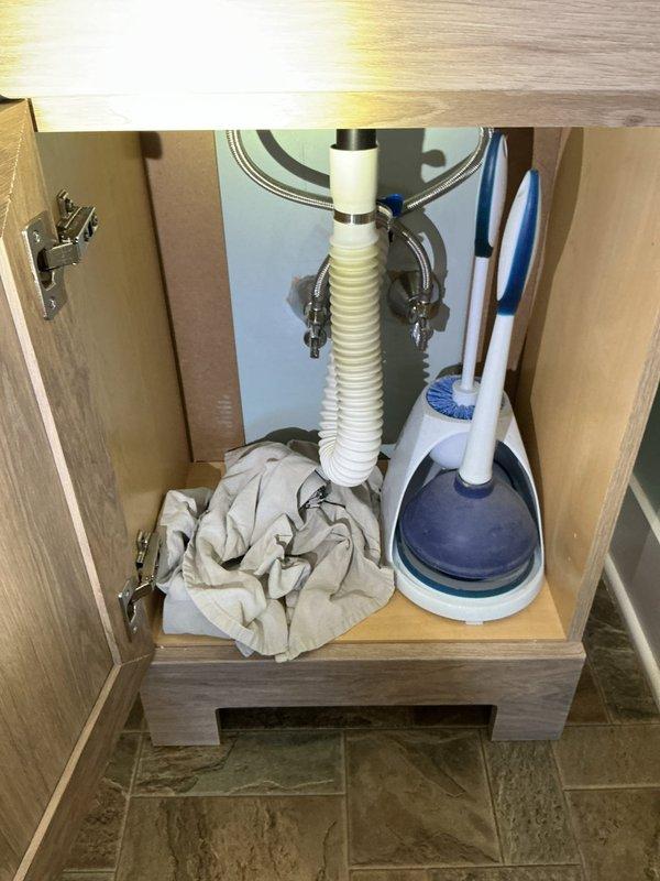 Replaced faulty sink shut-off valves and installed new P-trap assembly to address slow cold water flow and suspected leak. Verified proper water flow and leak-free operation after installation.