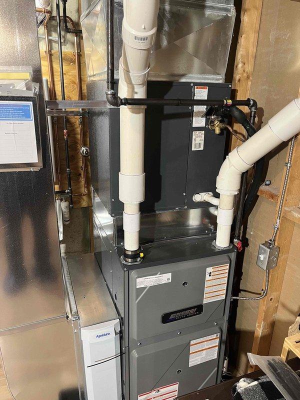 Successfully completed installation of new high-efficiency furnace system and Energy Star rated tankless water heater in utility area. Installed all necessary venting using PVC pipes, connected copper water lines with appropriate valves, and ensured proper electrical connections for both units. All systems were tested and confirmed to be functioning correctly with no leaks or operational issues.