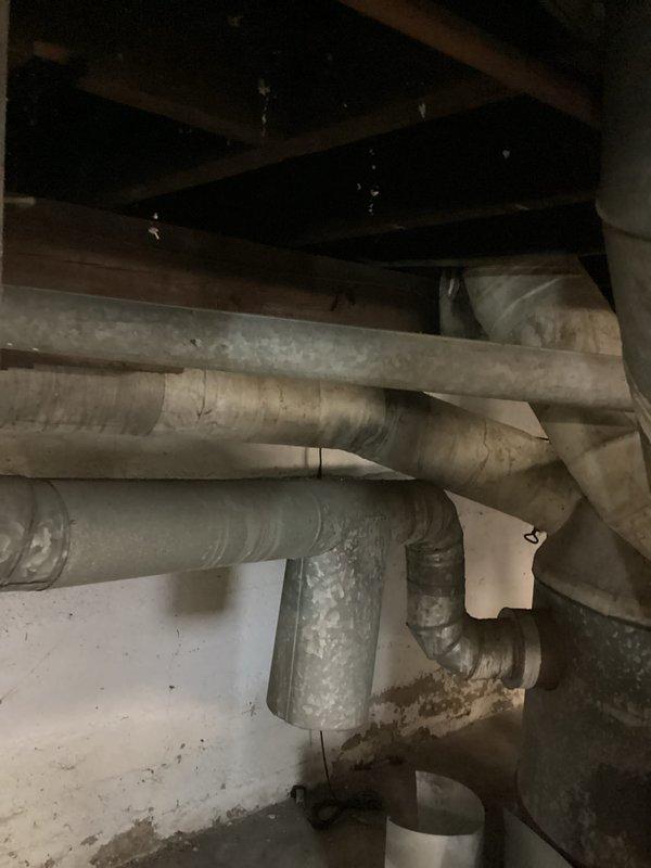 Completed rental inspection of senior property with gravity furnace. Performed required CO test in supply air and documented electrical panel conditions. Inspected basement infrastructure including ductwork, plumbing pipes, and insulation, noting overall system appears functional but aging.