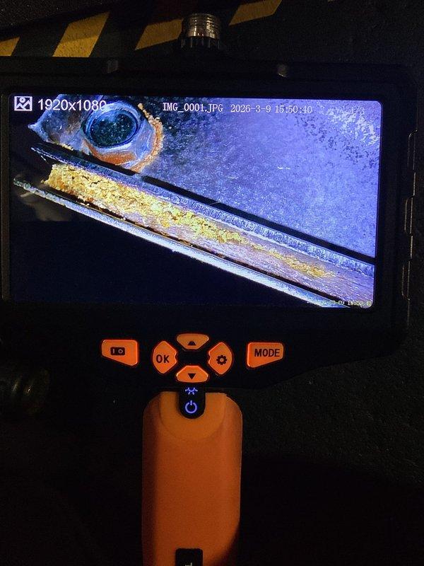 Performed annual heating maintenance on 8-year-old ENE furnace (warranty through 2027). Utilized borescope inspection to identify significant corrosion and buildup in heat exchanger. Cleaned flame sensor per service requirements. System operational but noted substantial internal deterioration requiring monitoring.