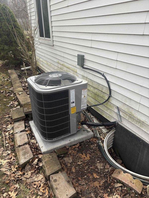 Successfully installed new furnace and air conditioning system with Michigan Saves financing approval. Properly mounted outdoor condenser unit on concrete pad with all electrical and refrigerant lines connected through siding. Completed all necessary ductwork connections and system controls in utility area, with final documentation submitted through Doc-U-Sign.