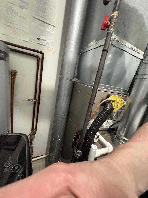 Successfully installed new furnace and air conditioning system with Michigan Saves financing approval. Properly mounted outdoor condenser unit on concrete pad with all electrical and refrigerant lines connected through siding. Completed all necessary ductwork connections and system controls in utility area, with final documentation submitted through Doc-U-Sign.