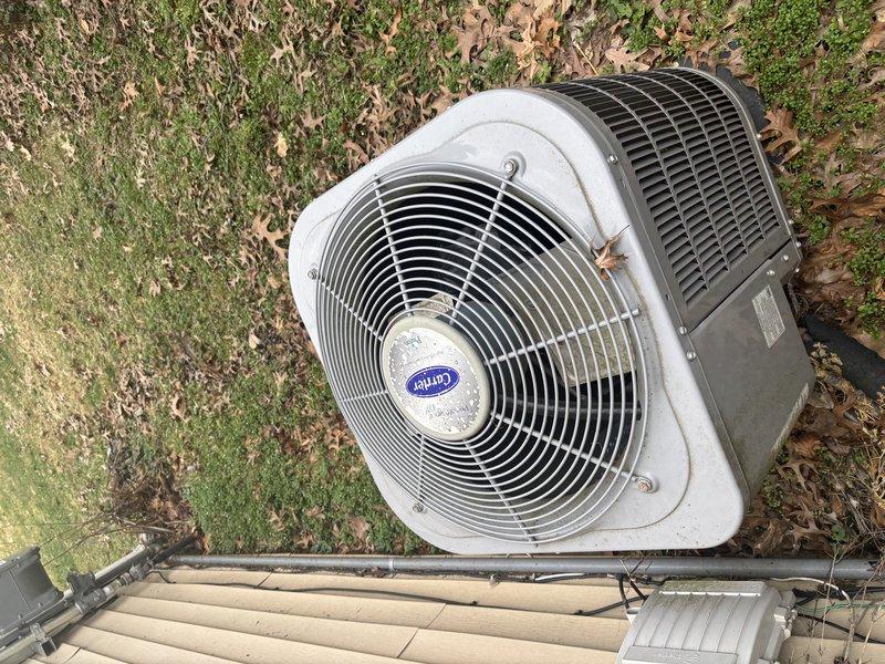Diagnosed and replaced non-functional thermostat that was preventing heating and cooling operation. Verified proper connection to Carrier condensing unit and confirmed system operation in both modes after installation of new thermostat.