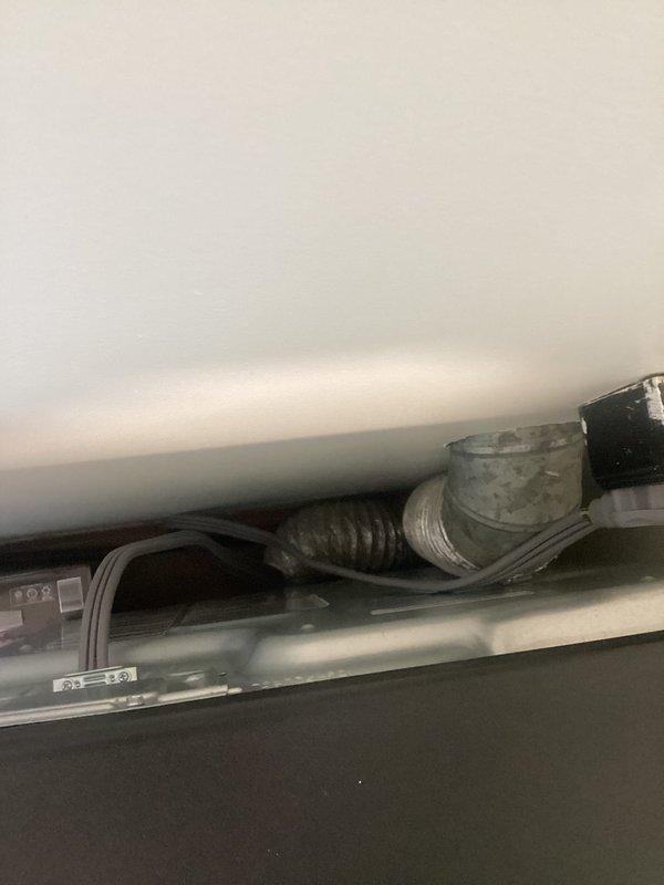 Completed assessment for dryer relocation project, which requires installation of a new exterior vent and sealing of the existing vent opening. Inspected current ventilation system components and exterior conditions to determine optimal placement for new vent installation. Documented existing HVAC setup and exterior wall conditions to ensure proper planning for the ventilation modification work.