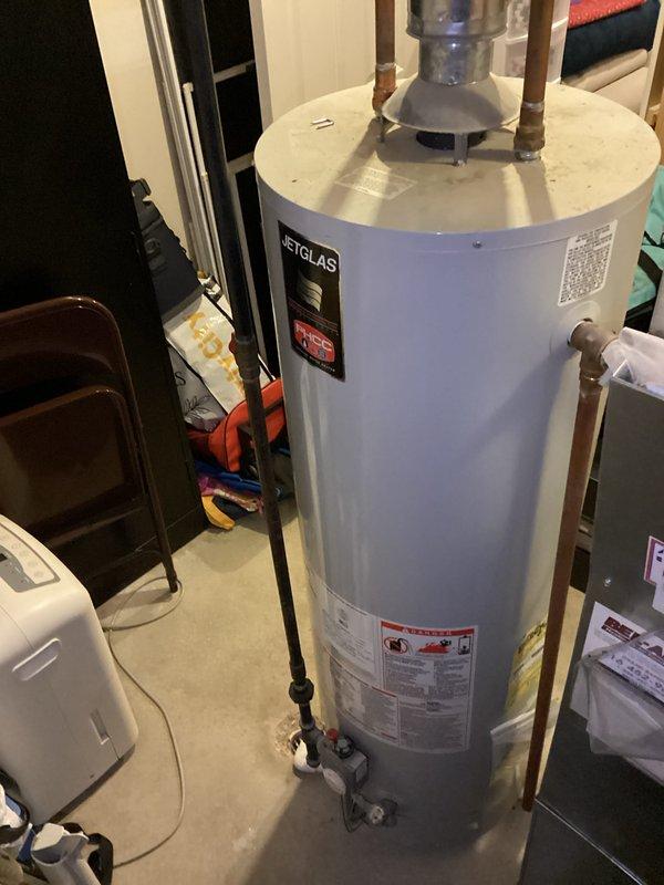 Conducted on-site water heater estimate for replacement of existing JetGlas unit. Inspected current installation, which includes copper supply/return lines and appears to be positioned in utility room on concrete slab. Documented condition of unit and surrounding plumbing components to provide accurate replacement options.