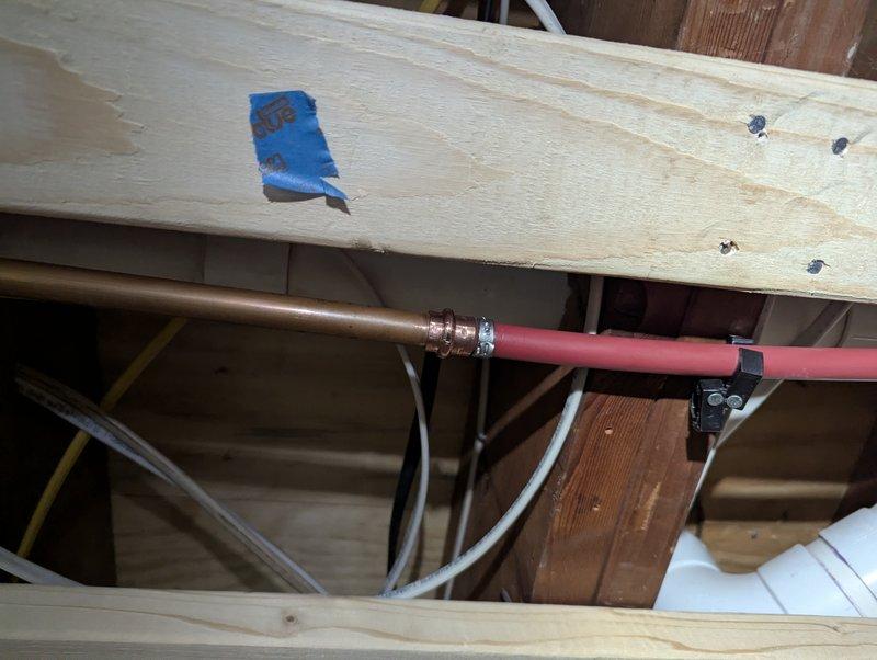 Completed QUOTR-quoted repair by replacing multiple SharkBite fittings on copper supply lines in the basement structural area. Removed compromised connections and installed new fittings, securing the piping properly to the wooden joists with appropriate brackets to ensure stable operation of the plumbing system that serves the radiator/heat exchanger unit.