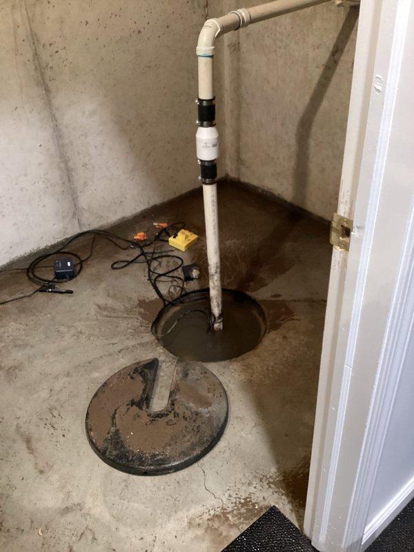 Responded to basement flooding issue caused by malfunctioning sump pump. Inspected the PVC discharge pipe assembly and found standing water in the sump pit. Replaced failed pump, checked electrical connections, and verified proper operation of the new unit to ensure adequate water removal and prevent future basement flooding.