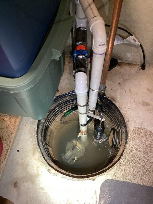 Responded to sump pump service call where customer reported water accumulation in basement. Inspected sump pit system with standing water and found partially submerged pump with compromised check valve assembly. Replaced faulty check valve, cleared debris from pump intake, and verified proper operation with successful water evacuation test.