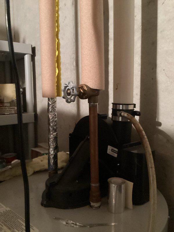 Conducted comprehensive assessment for water heater replacement in 20-year-old home with original water heater showing signs of age. Inspected existing plumbing connections including copper supply lines, gas line, and valve assembly. Documented current installation configuration to ensure proper sizing and compatibility for replacement unit.