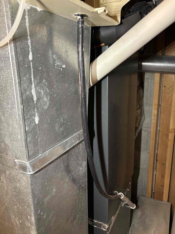 Performed annual heating maintenance on a 9-year-old Energy Furnace under club membership, including system tune-up and humidifier service. Inspected unit showing normal dust accumulation and proper condensate drainage through clear tube; system appears functionally sound with no immediate concerns noted. All maintenance completed according to manufacturer specifications with service warranty valid until 10-10-2026.