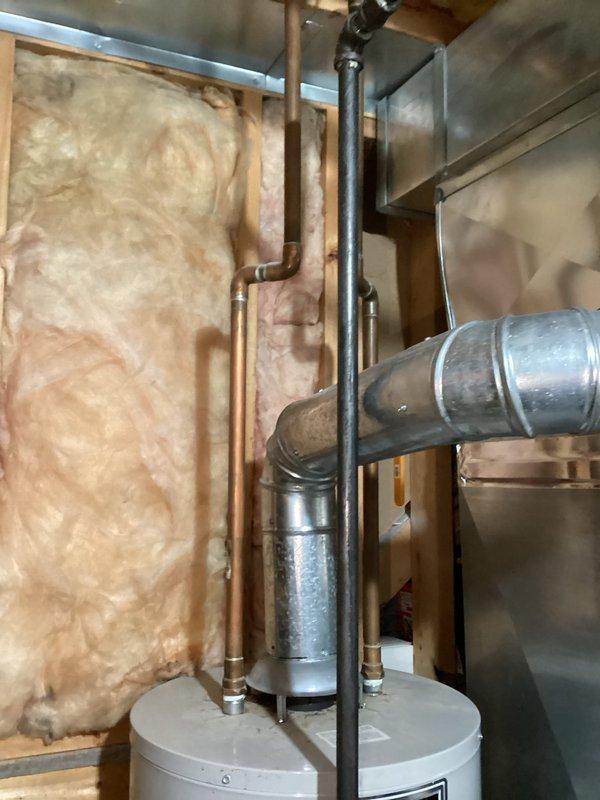 Conducted a water heater replacement estimate for a 20-year-old unit in a home of the same age. Documented current installation conditions including existing HVAC components, ductwork, plumbing connections, and surrounding insulation to determine proper replacement specifications. Photos were taken of the mechanical room layout to support the estimate preparation.
