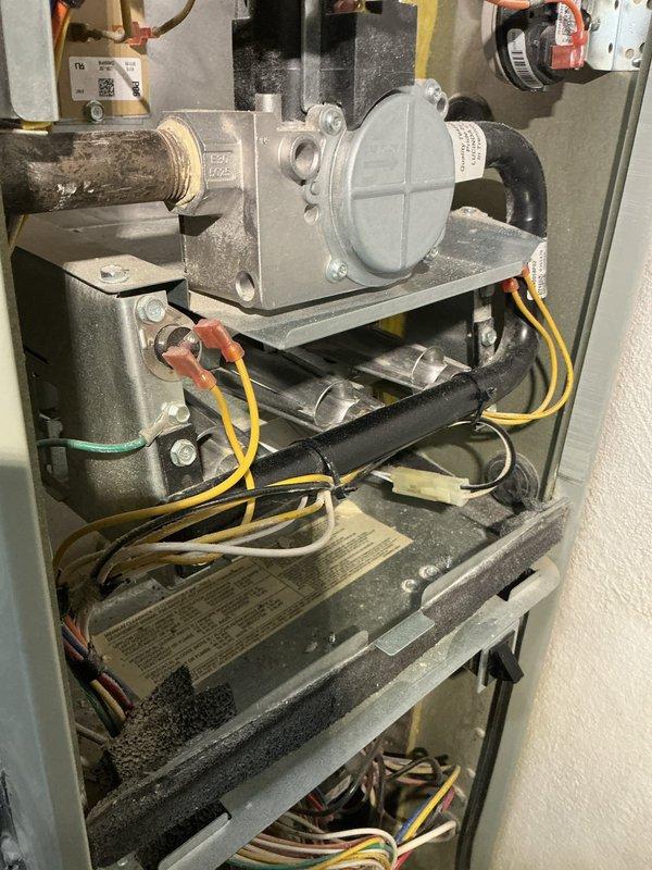 Performed annual furnace tune-up on 8-year-old American Standard system as requested. Inspected interior components including gas valve assembly, electrical connections, and mechanical parts. Noted normal dust accumulation consistent with age of unit; cleaned accessible components and verified proper operation of heating system.