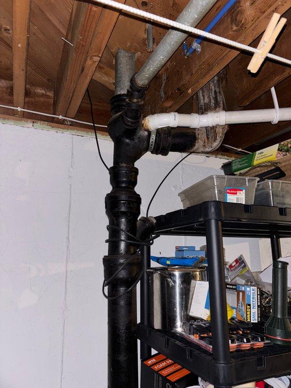 Responded to toilet leak issue. Inspected plumbing system in basement, focusing on waste line connections and vertical drainage pipes. Repaired leak, restored proper functionality, and verified system integrity, eliminating need for temporary bucket flushing solution.