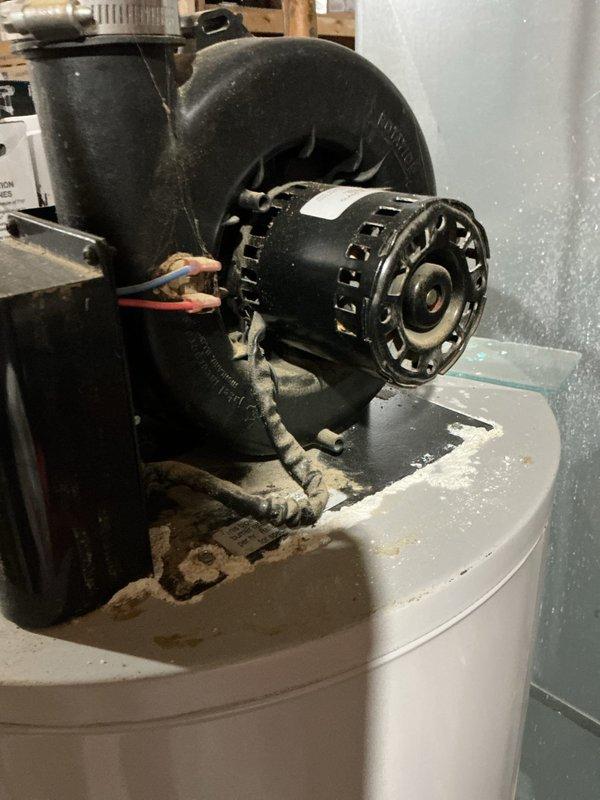 Responded to water softener malfunction complaint (CWOW). Upon inspection, found motor assembly on top of water softener tank showing significant corrosion and deterioration. Diagnosed electrical issue with motor connection, repaired wiring connections and cleaned corrosion from terminals to restore proper operation.