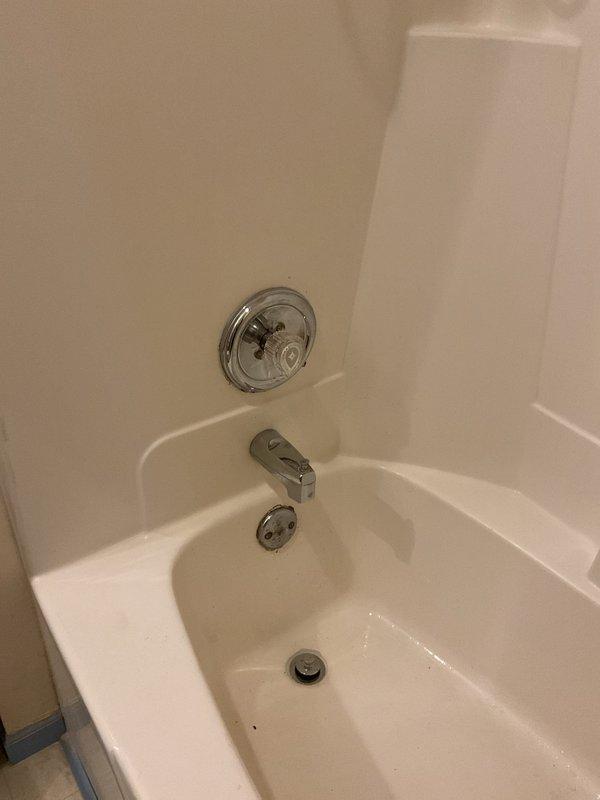Repaired leaking shower faucet in primary bathroom by replacing worn cartridge assembly and adjusting pressure regulator. Additionally, installed new pop-up drain assemblies in both bathtubs, ensuring proper water retention and drainage functionality.