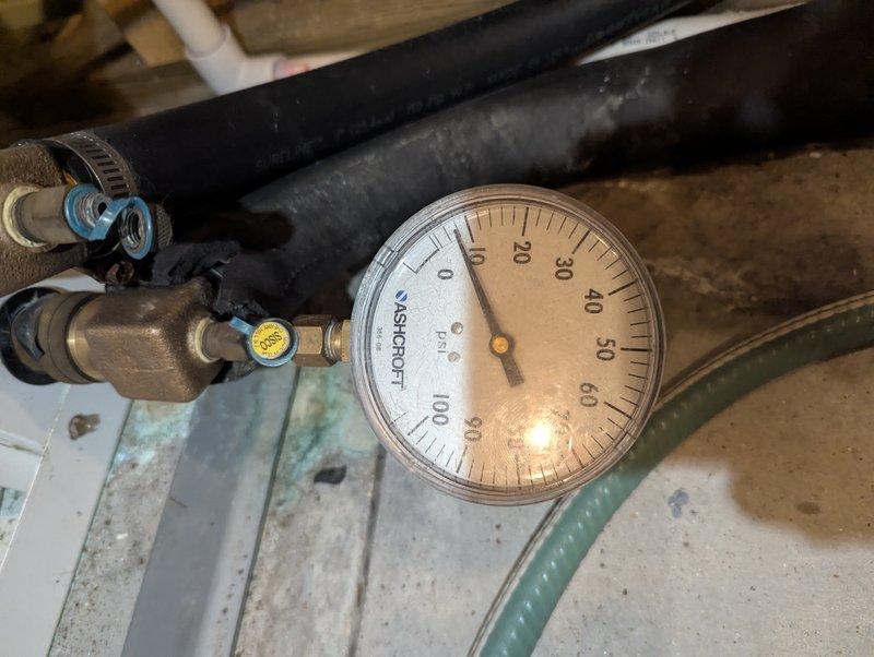 Responded to service call for geothermal heat pump locking out with "Water flow" LED indicator. Diagnosed air trapped in system causing rattling in geo pump and rapid cooling of loop inlet/outlet lines. Verified system pressure readings (30-35 PSI inlet, 20-25 PSI outlet) and purged trapped air from geothermal loop to restore proper circulation and system operation.