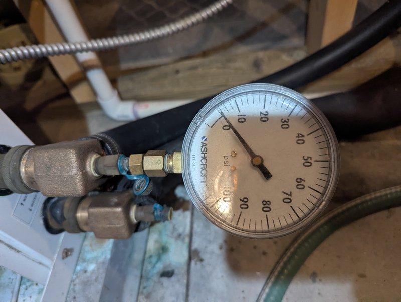 Responded to service call for geothermal heat pump locking out with "Water flow" LED indicator. Diagnosed air trapped in system causing rattling in geo pump and rapid cooling of loop inlet/outlet lines. Verified system pressure readings (30-35 PSI inlet, 20-25 PSI outlet) and purged trapped air from geothermal loop to restore proper circulation and system operation.