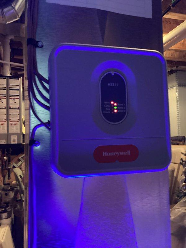 Completed annual heating maintenance on Heil furnace (0 years old). Inspected ductwork connections and sealing in attic space, noting proper foil tape application at joints. Verified operation of Honeywell control module (M2311) with all indicator lights functioning normally.