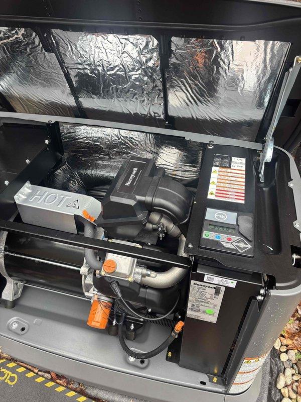 Performed scheduled tune-up on Honeywell generator (0-year unit, CM: 2023). Inspected and verified proper operation of all key components including fuel system with orange filter assembly and control panel indicators showing normal operation. Unit appears well-maintained with no visible issues detected.