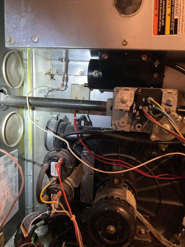 Responded to No Heat call where thermostat was set at 71° but home temperature was 65°. Inspection revealed significant debris and blockage in the furnace exhaust vent pipe, which was preventing proper ventilation and causing the unit to shut down. Cleaned vent pipe thoroughly and verified system operation, restoring normal heating function.