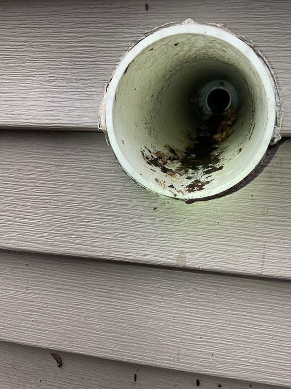 Responded to No Heat call where thermostat was set at 71° but home temperature was 65°. Inspection revealed significant debris and blockage in the furnace exhaust vent pipe, which was preventing proper ventilation and causing the unit to shut down. Cleaned vent pipe thoroughly and verified system operation, restoring normal heating function.