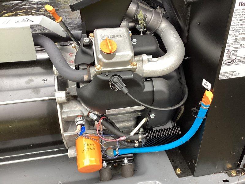 Performed scheduled maintenance on Honeywell generator (WT 4-2027). Conducted comprehensive tune-up including oil change with filter replacement as evidenced by new orange filter installation. Inspected all connections, hoses, and operational components - system is functioning properly with no visible issues or abnormal wear detected.