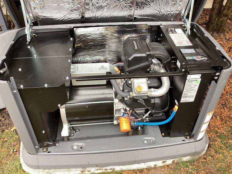 Performed scheduled maintenance on Honeywell generator (WT 4-2027). Conducted comprehensive tune-up including oil change with filter replacement as evidenced by new orange filter installation. Inspected all connections, hoses, and operational components - system is functioning properly with no visible issues or abnormal wear detected.