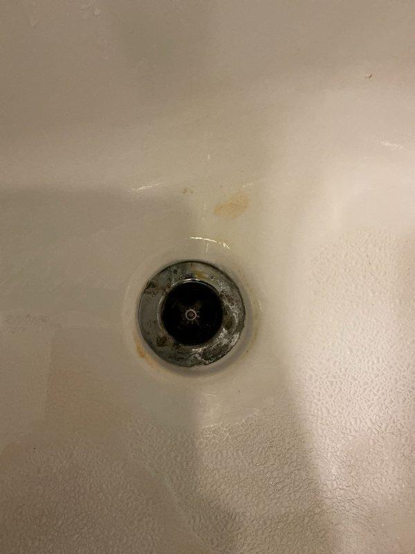 Completed inspection and repair of persistent dripping shower in primary bathroom. Identified mineral buildup and worn components in drain assembly of second bathroom that were causing drainage issues despite previous snaking attempts. Removed accumulated deposits, replaced worn gaskets and installed new drain assembly components to restore proper functionality to both fixtures.
