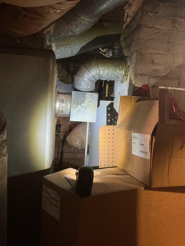 Conducted comprehensive HVAC assessment for single-family home requiring new furnace and AC installation to replace existing oversized, aging furnace (no current AC system). Documented need for additional supply and return vents for upstairs area which currently lacks heating/cooling. Photographed current basement HVAC configuration showing outdated ductwork that will require modification to properly service the previously separate upstairs living space.